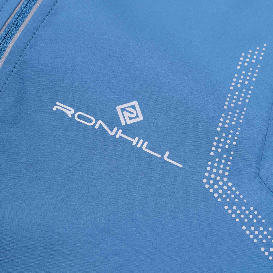 Close-up view of the reflective details on the Ronhill Men's Tech Reflect Jacket in the Glacier/Reflect colourway.