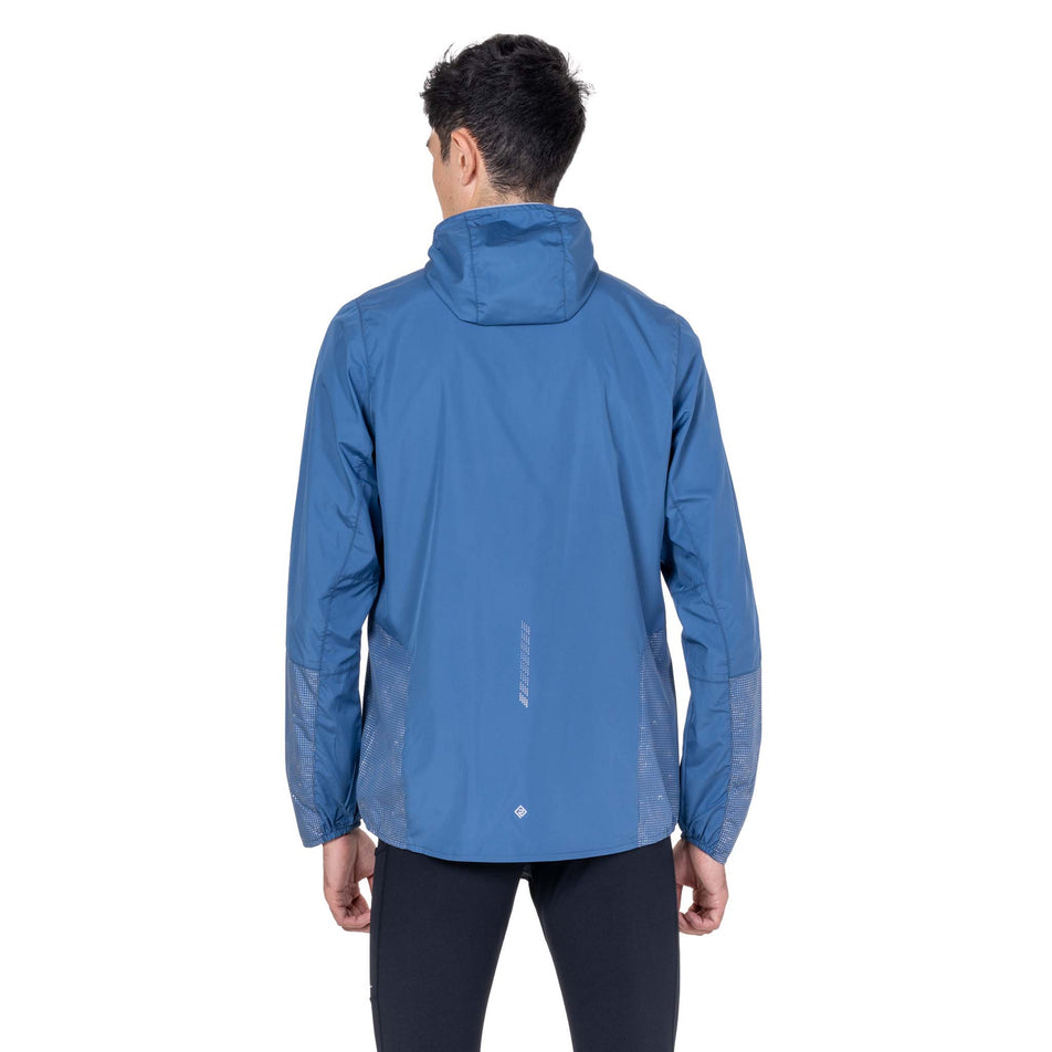 Back view of a model wearing the Ronhill Men's Tech Reflect Jacket in the Glacier/Reflect colourway.