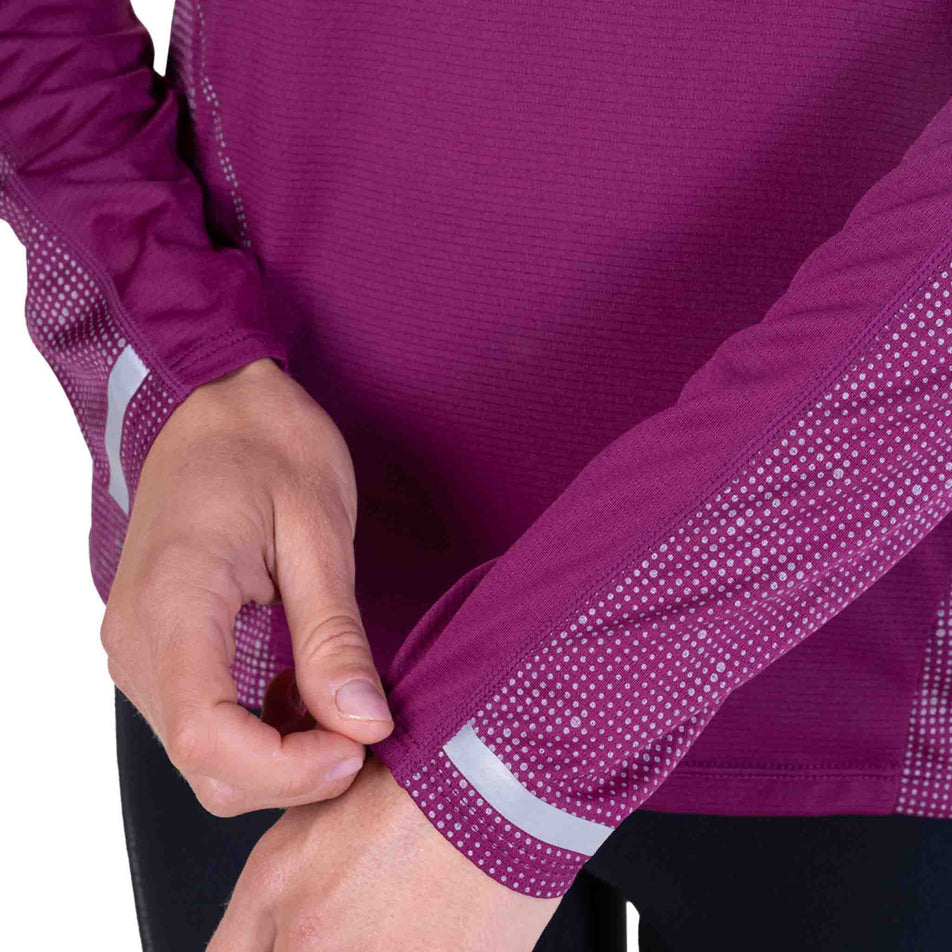 Close-up view of the sleeve of the Ronhill Women's Tech Reflect L/S Tee in the Blackcurrant/Reflect colourway.