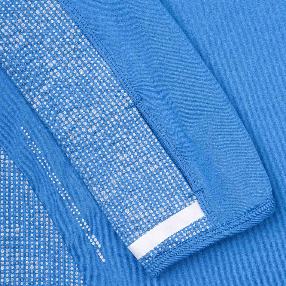 Close-up view of the reflective pattern on the Ronhill Women's Tech Reflect 1/2 Zip in the Lumiere/Reflect colourway.