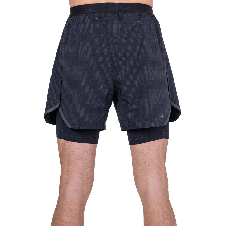 Back view of a model wearing the Ronhill Men's Tech Reflect Lux 5