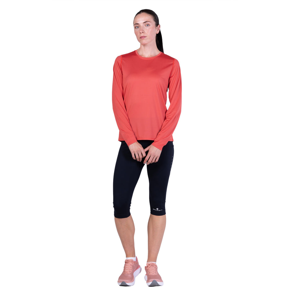 Front view of a model wearing the Ronhill Women's Core L/S Tee - Sumac/Blue Violet in the colourway.
