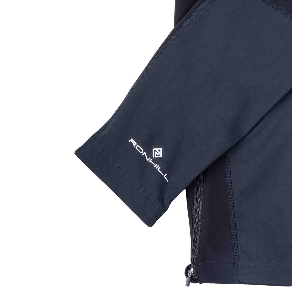Close-up view of the ankle cuff of the Ronhill Men's Tech Wind-Block Tight in the All Black colourway.