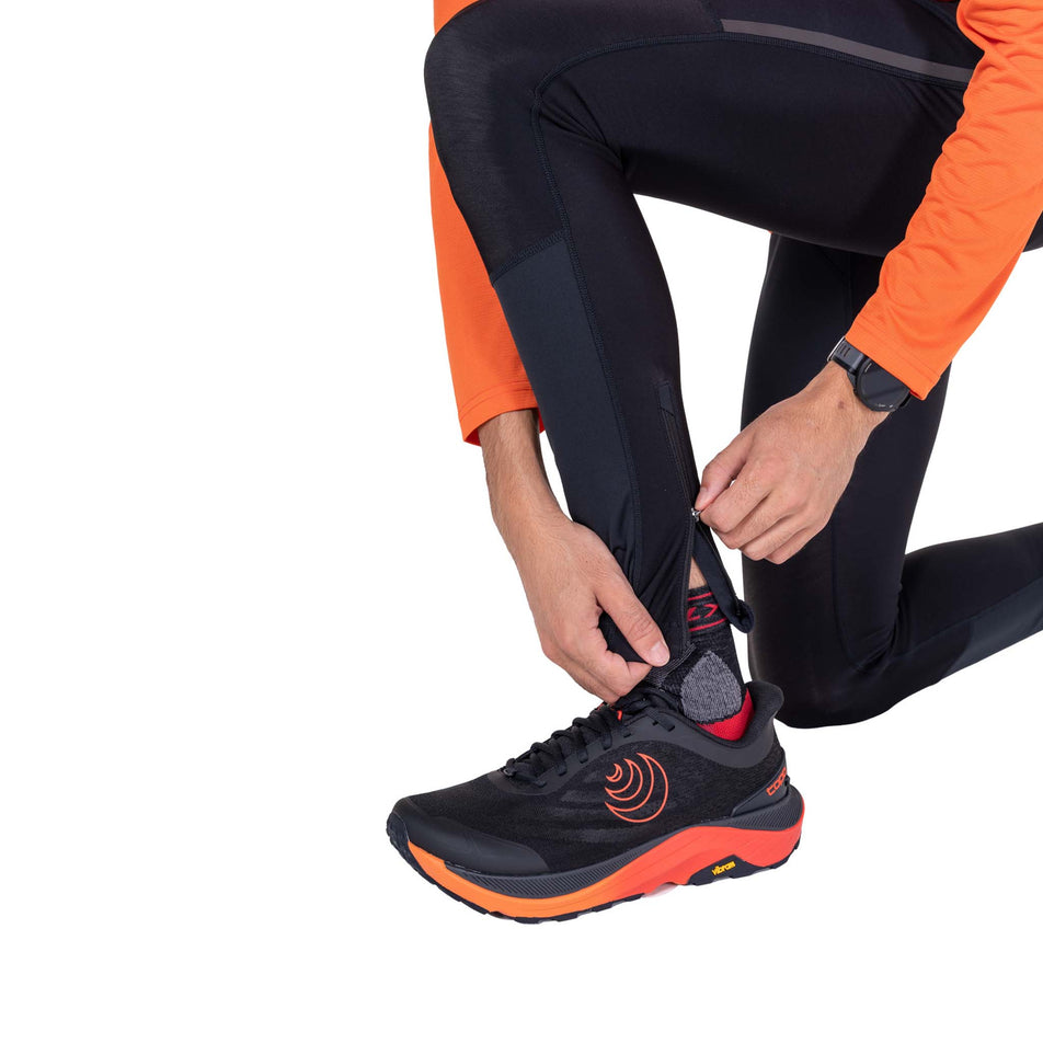 The ankle zip on the Ronhill Men's Tech Wind-Block Tight in the All Black colourway.
