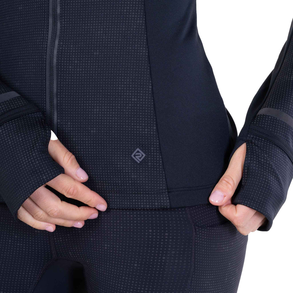 The Ronhill logo on the Ronhill Women's Tech Reflect Lux Jacket in the Black/Reflect colourway.