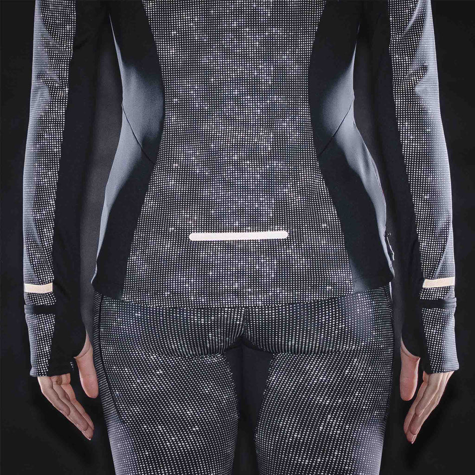 The reflective print on the Ronhill Women's Tech Reflect Lux Jacket in the Black/Reflect colourway.