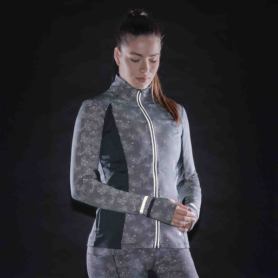 The reflective print on the Ronhill Women's Tech Reflect Lux Jacket in the Black/Reflect colourway.