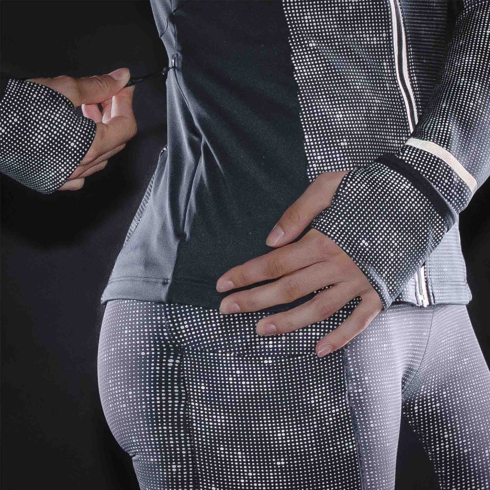 The reflective print on the Ronhill Women's Tech Reflect Lux Jacket in the Black/Reflect colourway.