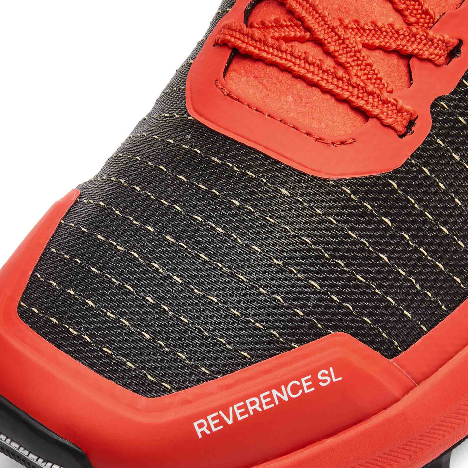 Close-up view of the toe box of the left shoe from a pair of Ronhill Men's Reverence SL Running Shoes in the Black/Red colourway.