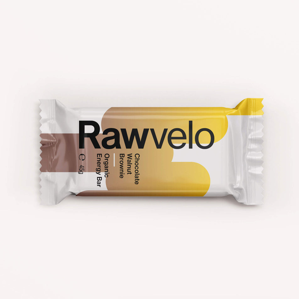 Front of a Rawvelo Chocolate Walnut Brownie Organic Energy Bar's warpper. (8332520947874)