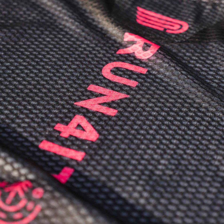 Close-up of the Pressio logo and Run4It branding on the back of the Run4It Run Club Women's Elite Singlet. (8489118728354)