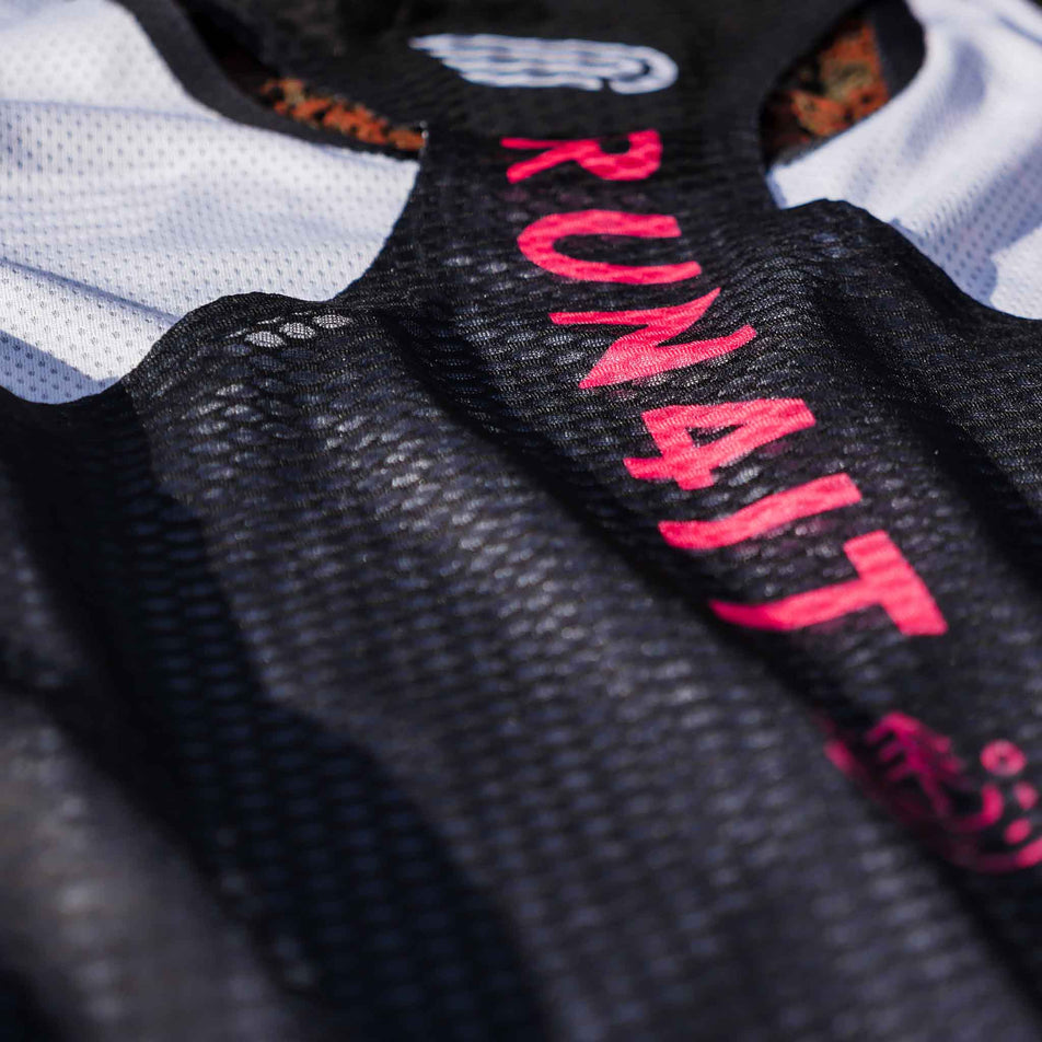 Close-up of the Pressio logo and Run4It branding on the back of the Run4It Run Club Women's Elite Singlet. (8489118728354)