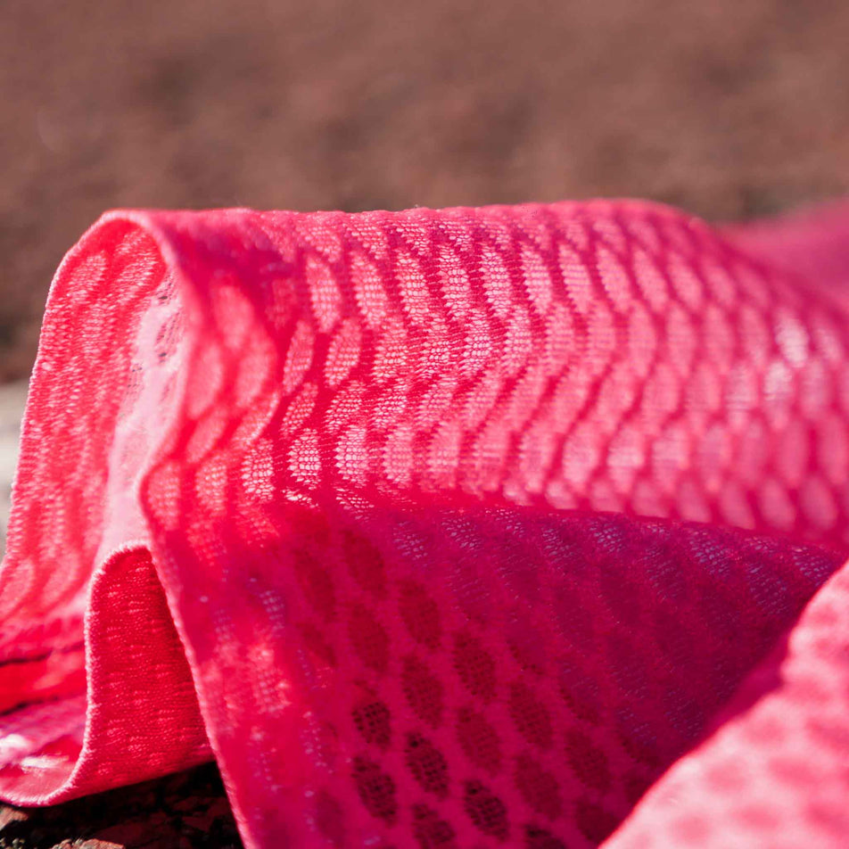 Close-up fabric on the lower section of the Pressio Run4It Run Club Women's Elite Tee. (8489111388322)