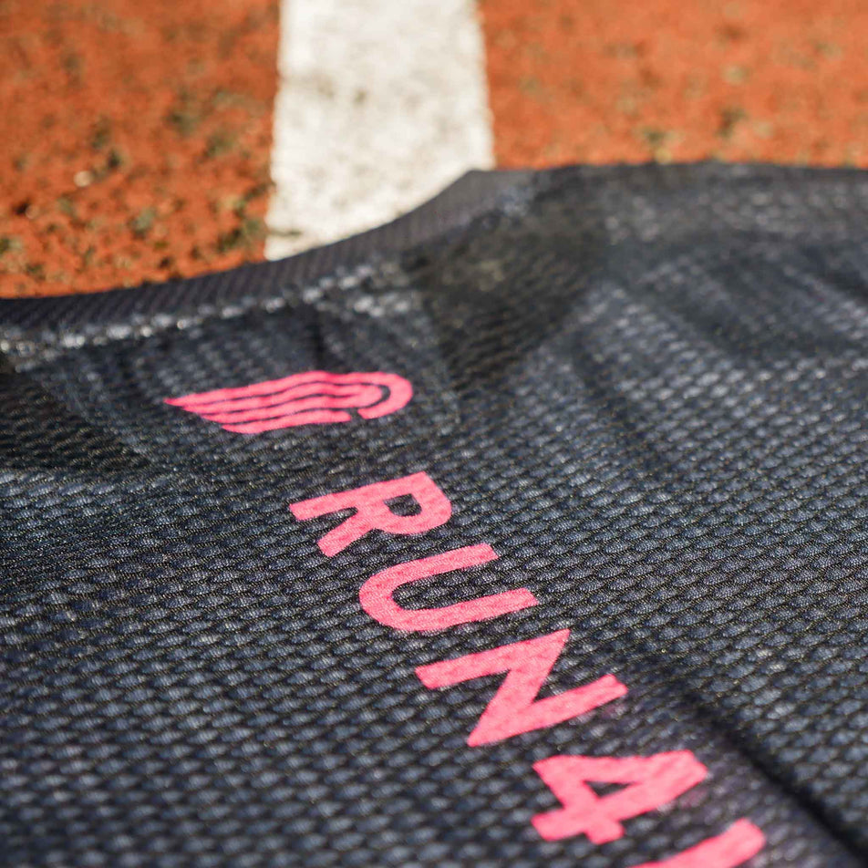 Close-up of the Pressio logo and Run4It branding on the back of the Pressio Run4It Run Club Women's Elite Tee. (8489111388322)