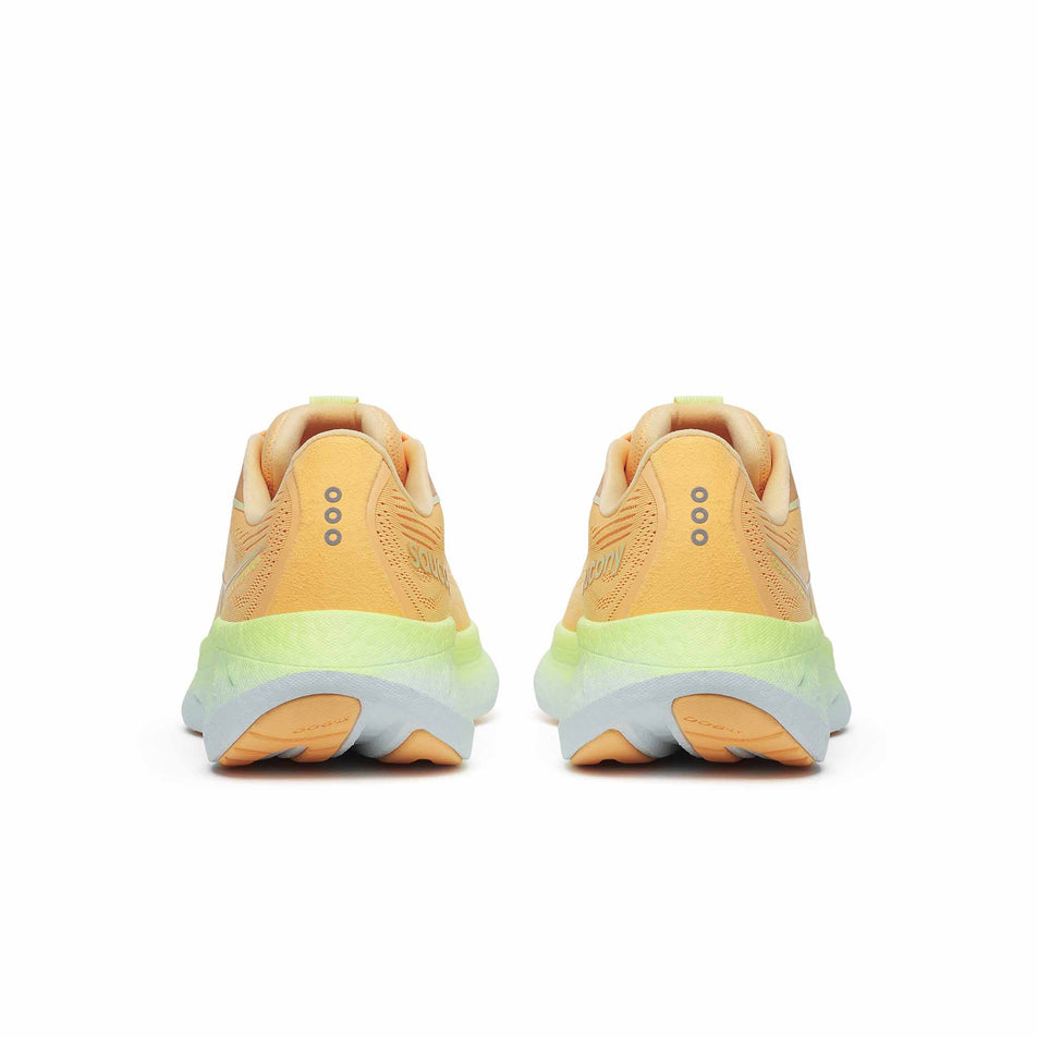 The back of a pair of Saucony Women's Ride 18 Running Shoes in the Peach/Sunny colourway. (8579051356322)