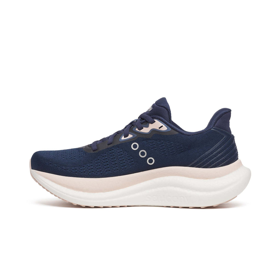 Medial view of the right shoe from a pair of Saucony Women's Triumph 23 Running Shoes in the Navy/Cameo colourway. (8654990180514)