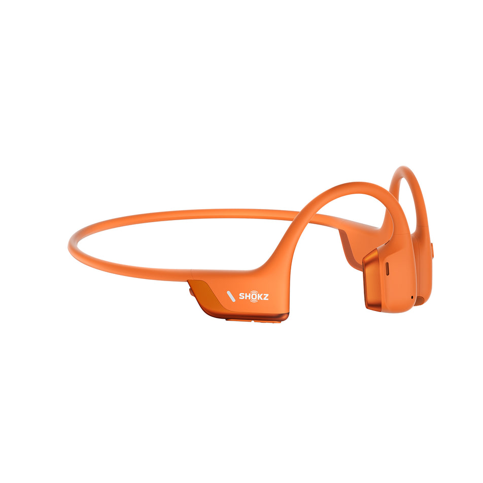 A pair of Shokz Unisex OpenRun Pro 2 Wireless Bone Conduction Headphones in the Orange colourway. (8541428088994)