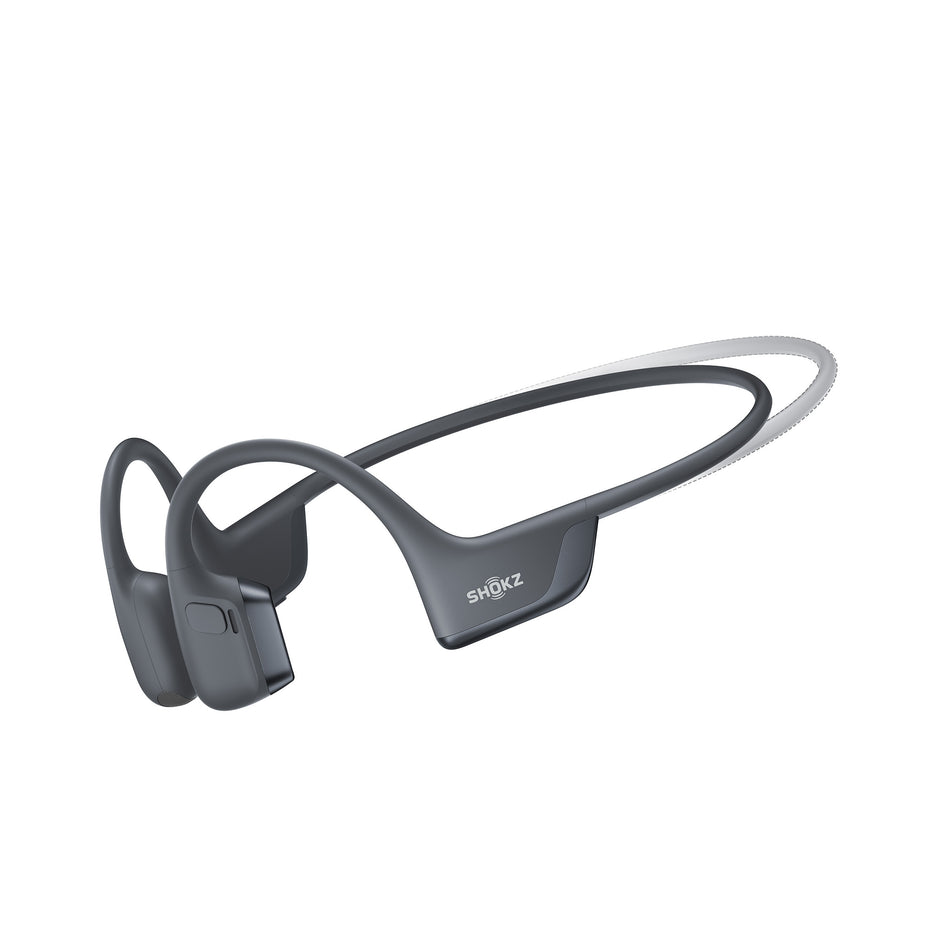 A pair of Shokz Unisex OpenRun Pro 2 Mini Wireless Bone Conduction Headphones, in the Black colourway, against the outline of the standard size. (8541430087842)