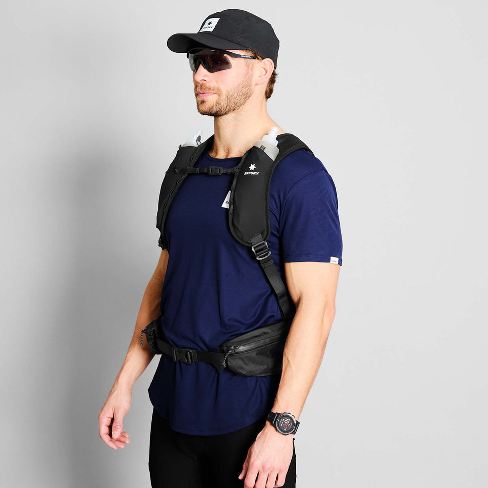 Back view of a model wearing the SAYSKY Unisex Commuter Backpack 14L in the Black colourway.