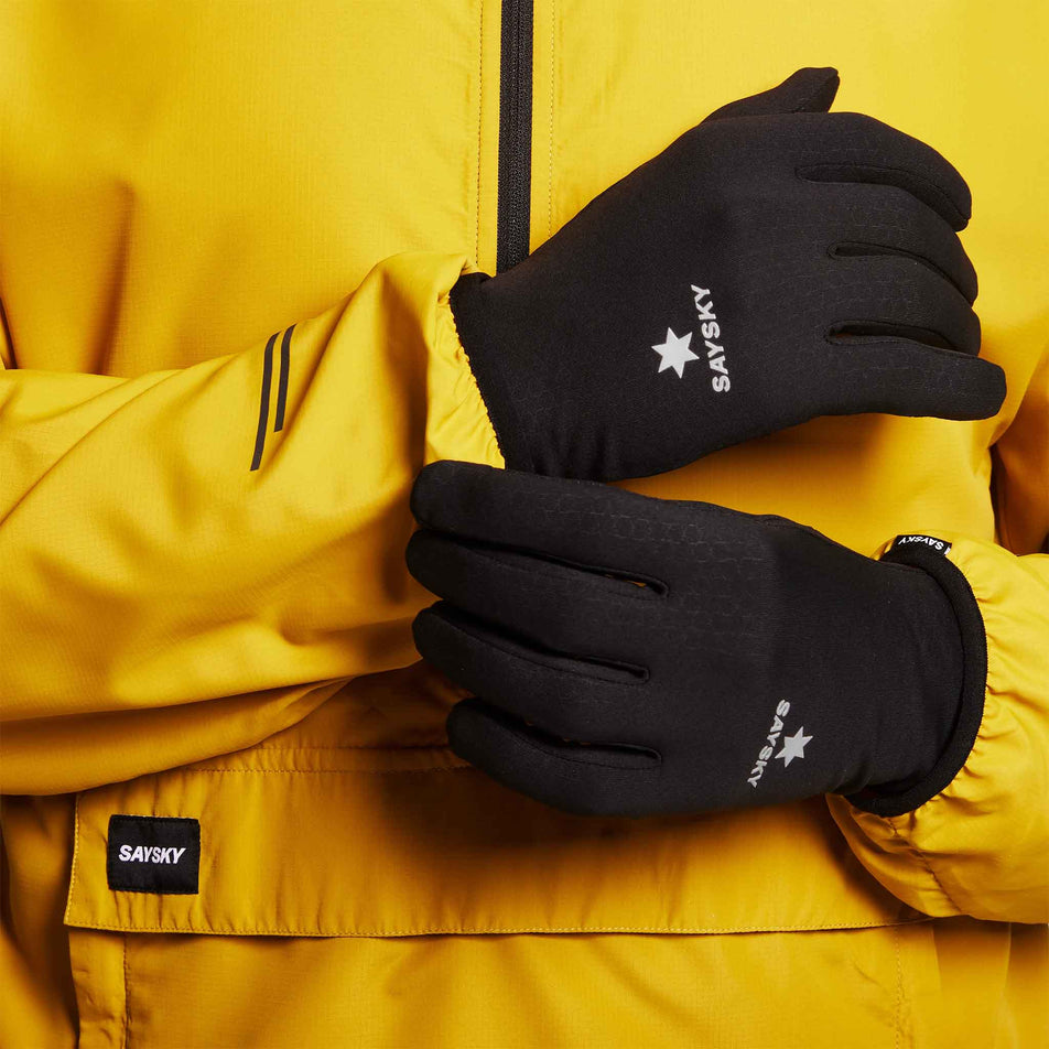 A model wearing a pair of SAYSKY Unisex Combat Gloves in the Black colourway.