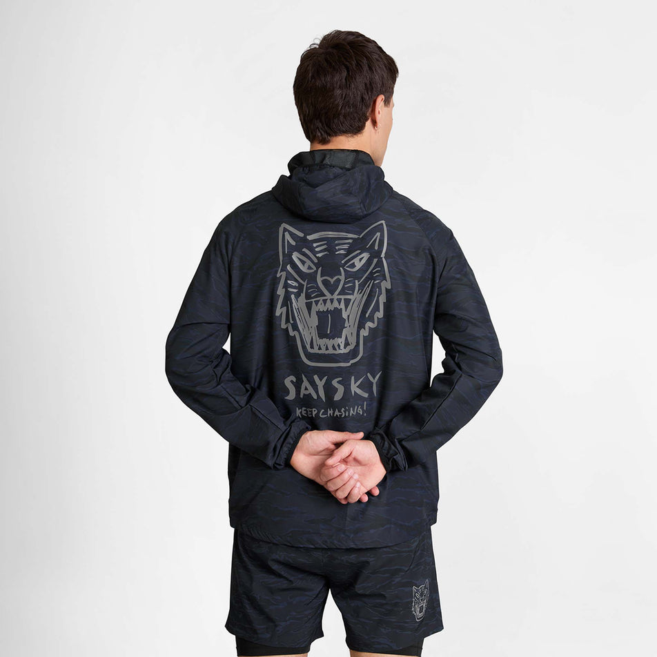 Back view of a model wearing the SAYSKY Men's Tiger Pace Jacket in the Black Camo colourway.