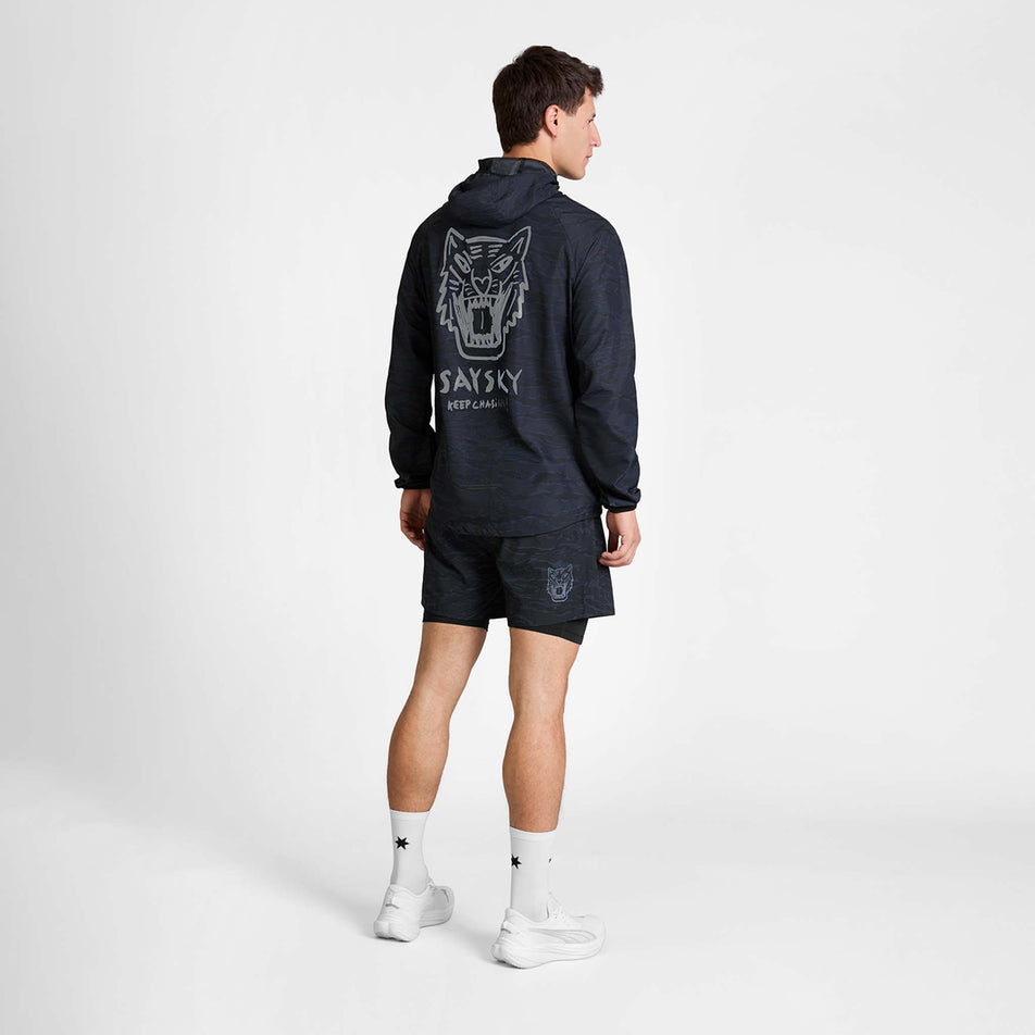 Back view of a model wearing the SAYSKY Men's Tiger Pace Jacket in the Black Camo colourway.