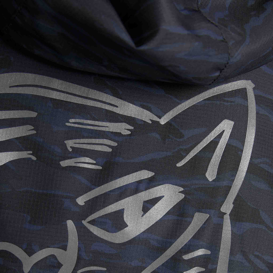 Close-up view of the graphic on the back of the SAYSKY Men's Tiger Pace Jacket in the Black Camo colourway.