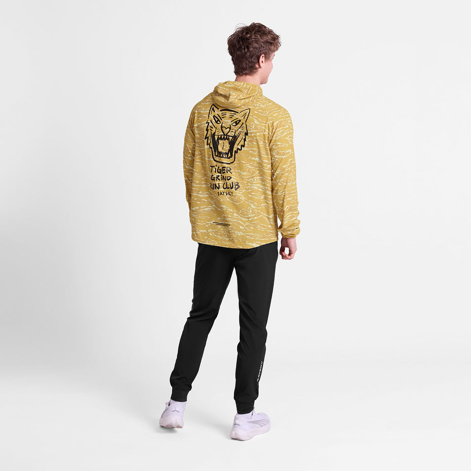 Back view of a model wearing the SAYSKY Men's Tiger Pace Jacket in the Yellow colourway.