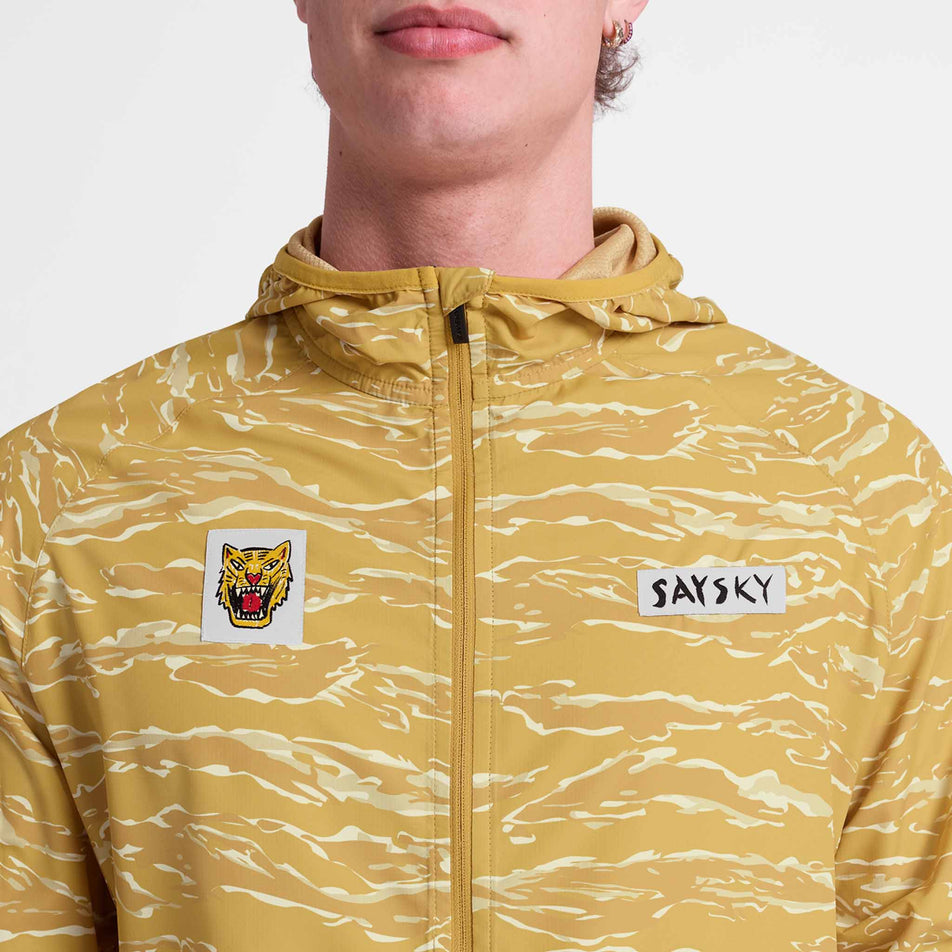 Front view of a model wearing the SAYSKY Men's Tiger Pace Jacket in the Yellow colourway.