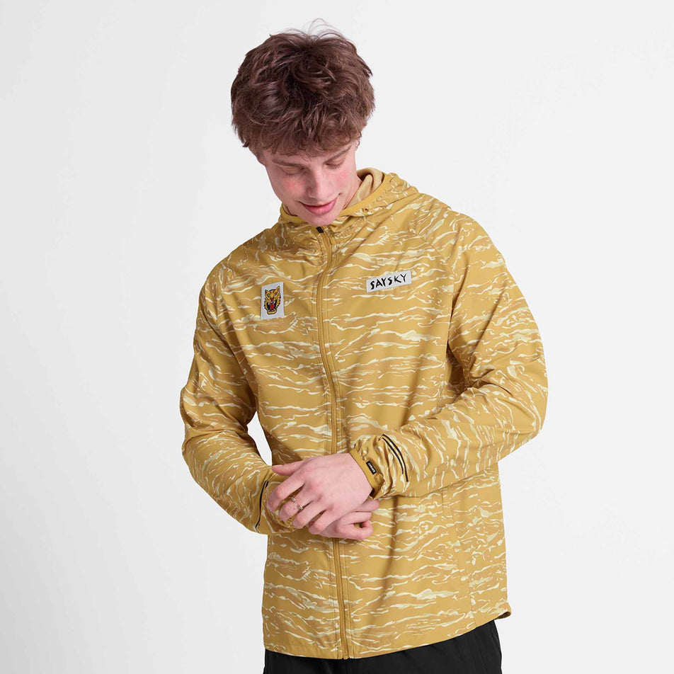 Front view of a model wearing the SAYSKY Men's Tiger Pace Jacket in the Yellow colourway.