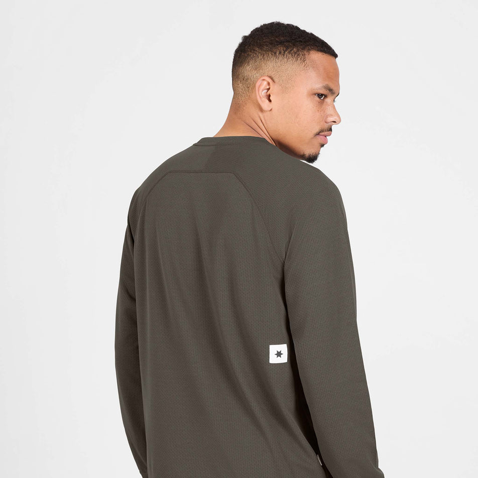 Back view of a model wearing the SAYSKY Men's Pace Tech Long Sleeve in the Brown colourway.