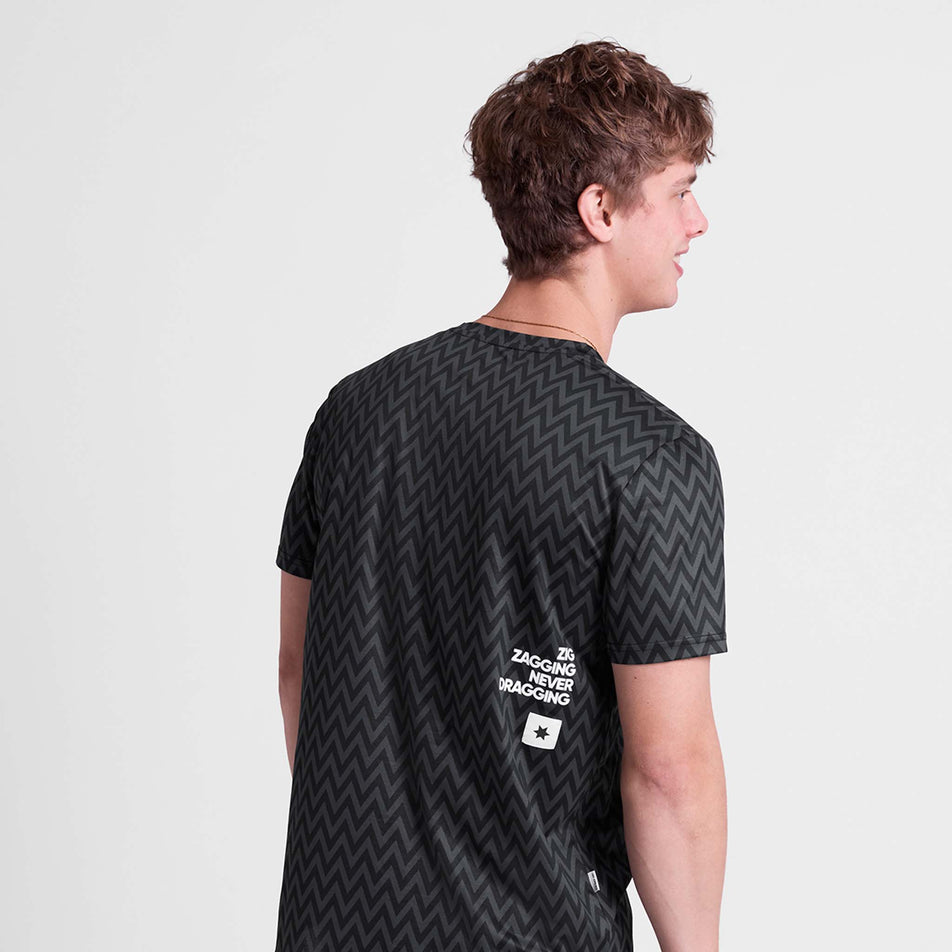 Back view of a model wearing the SAYSKY Men's Zig Zag Combat T-Shirt in the Black Zig Zag colourway.