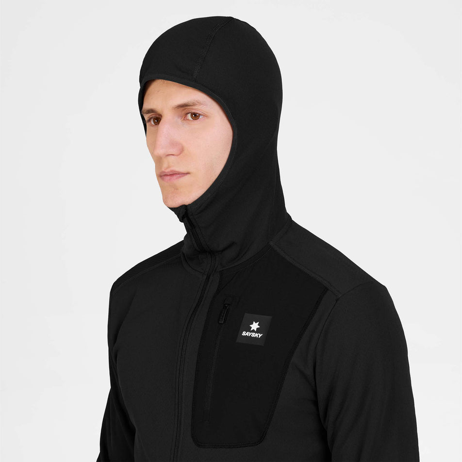 Front view of a model wearing the SAYSKY Men's Combat Half Zip Fleece Hoodie in the Black colourway.