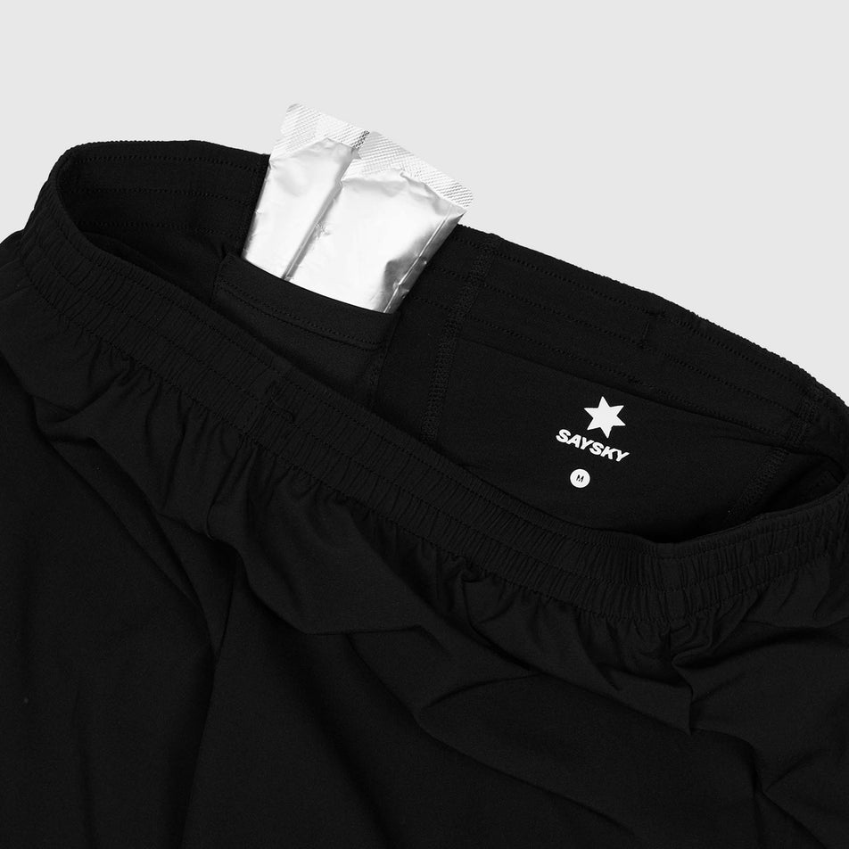 The gel storage pouches inside the waistband of the SAYSKY in the Men's Pace 2 In 1 Shorts 5