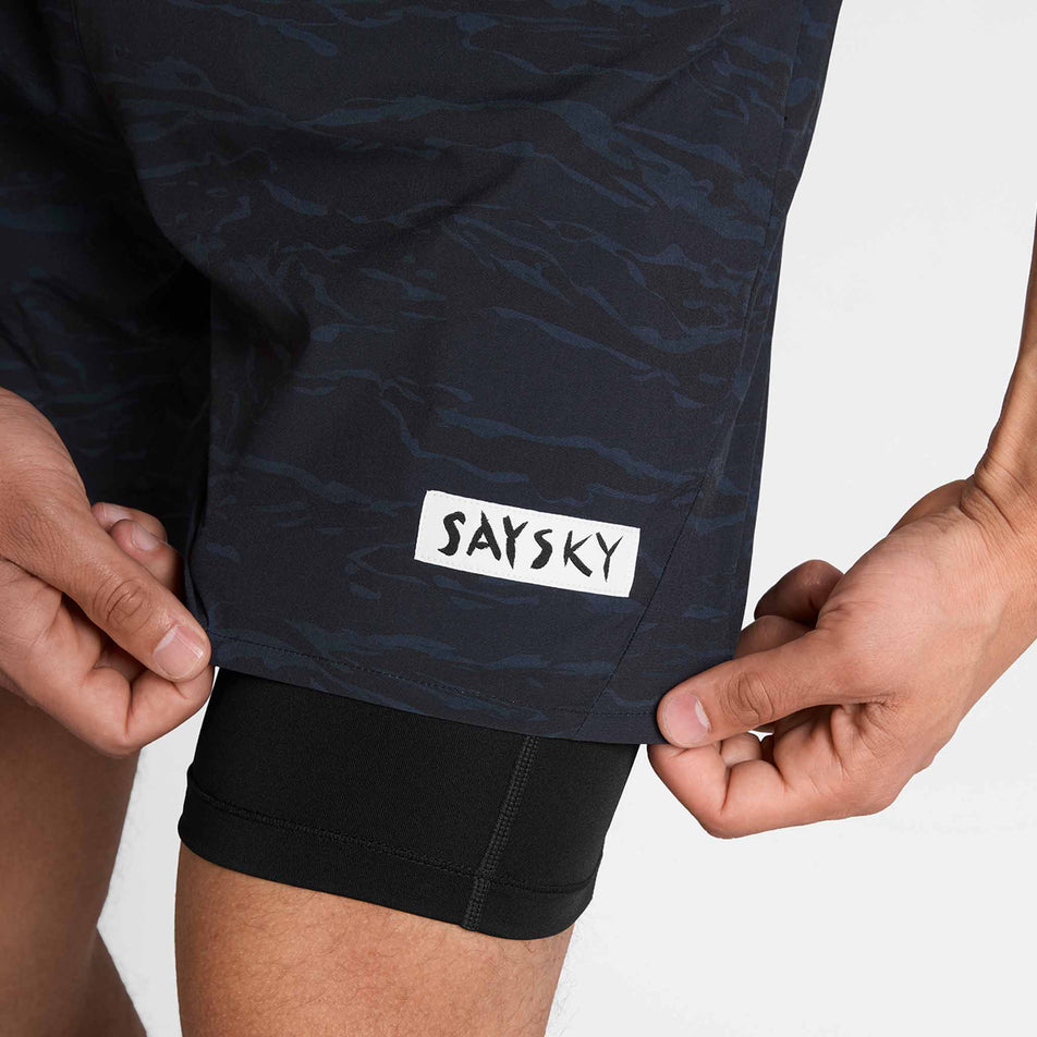 Close-up view of the SAYSKY logo on the front of the SAYSKY Men's Tiger Pace 2 In 1 Shorts 5