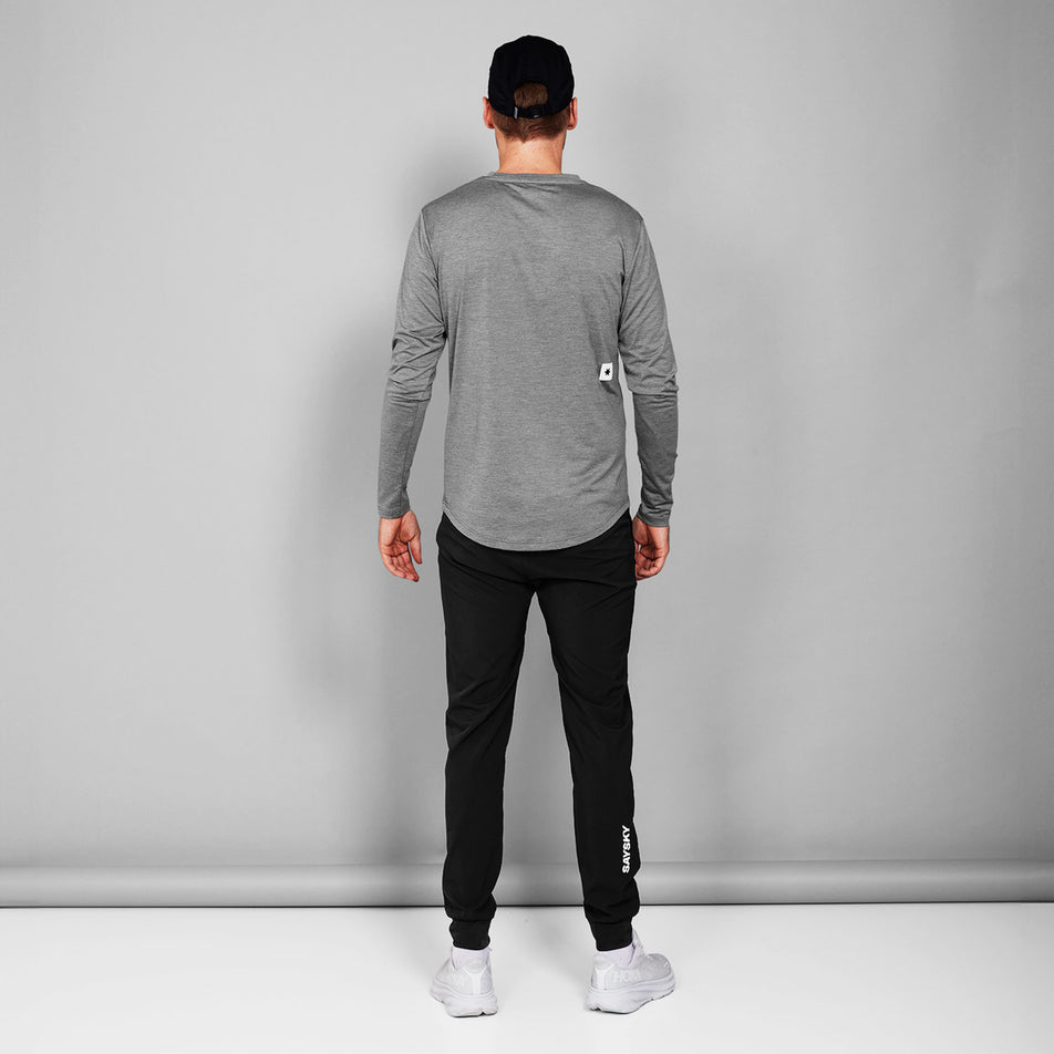 Back view of a model wearing the SAYSKY Unisex Pace Pants in the Black-26 colourway.