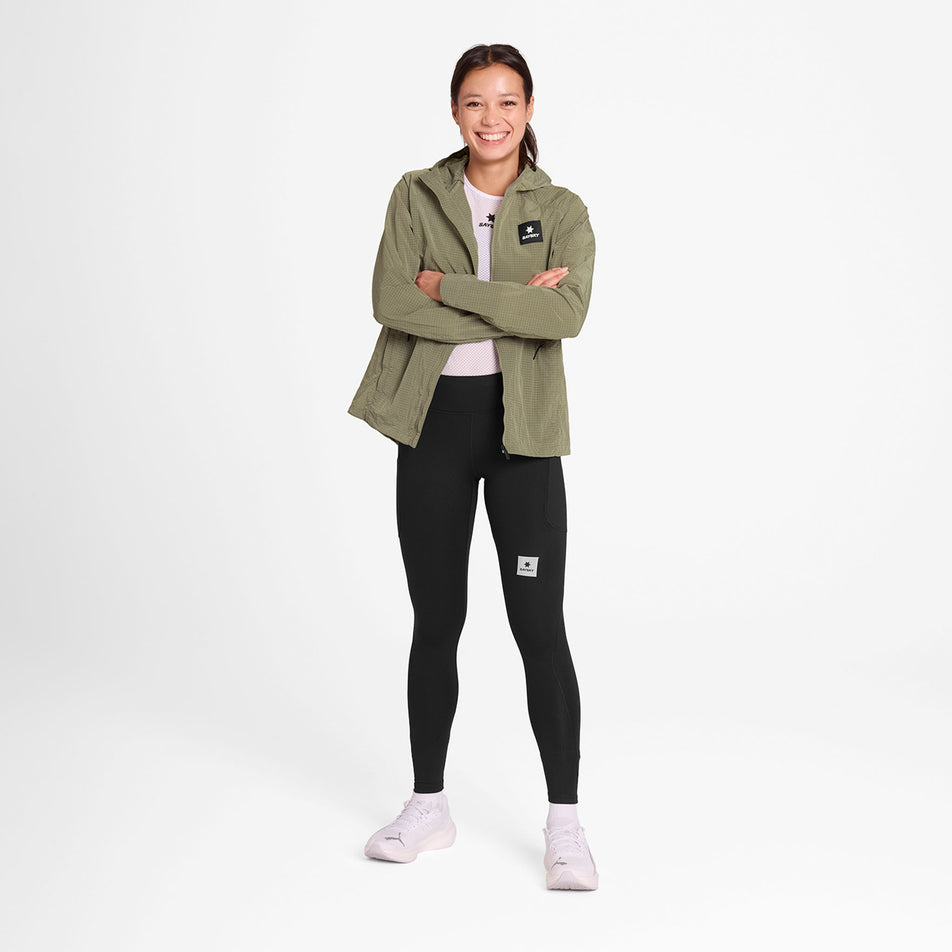 Front view of a model wearing the SAYSKY Women's Clean Pace Shield Jacket in the Beige colourway.