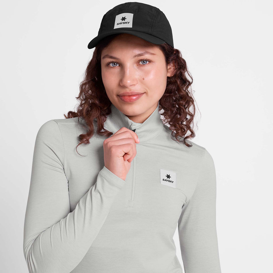 Front view of a model wearing the SAYSKY Women's Pace 1/2 Zip Long Sleeve in the Grey colourway.