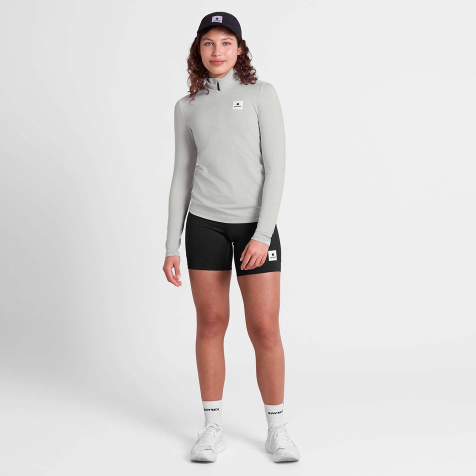 Front view of a model wearing the SAYSKY Women's Pace 1/2 Zip Long Sleeve in the Grey colourway.