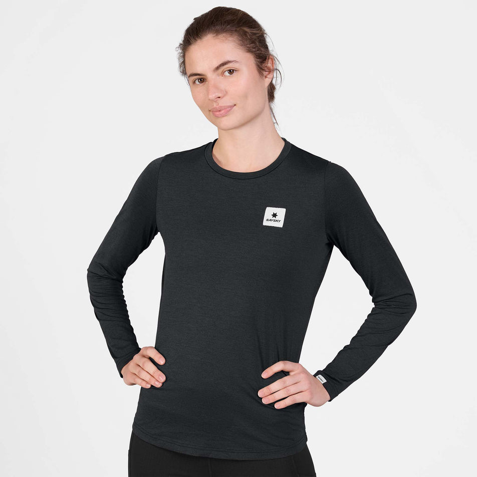 Front view of a model wearing the SAYSKY Women's Clean Pace Long Sleeve in the Black colourway.