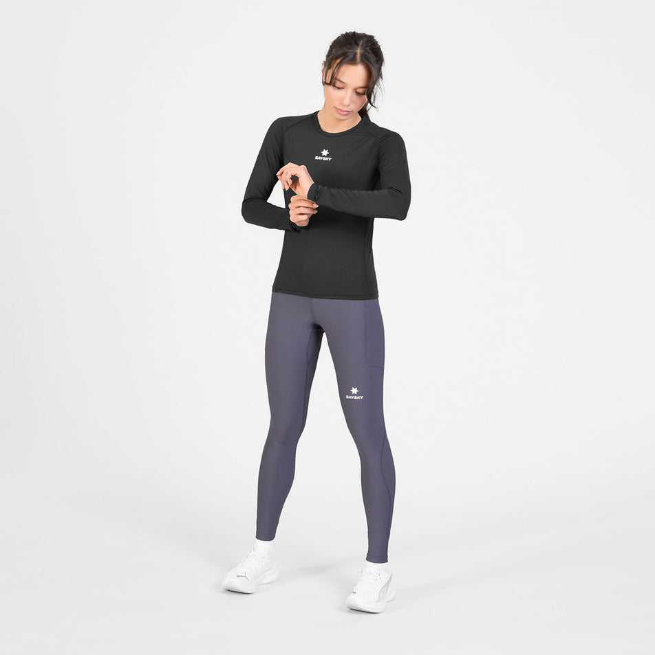 Front view of a model wearing the SAYSKY Women's Combat Tech Long Sleeve in the Black colourway.