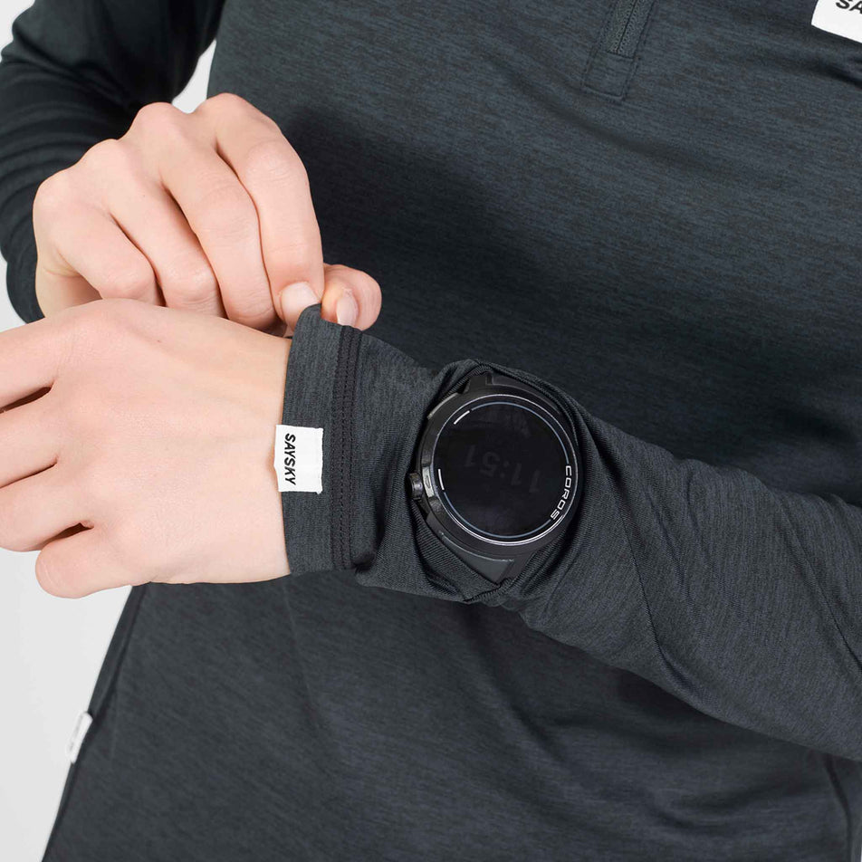 Close-up view of the watch window on the SAYSKY Women's Tiger Pace Half Zip Long Sleeve in the Black colourway.