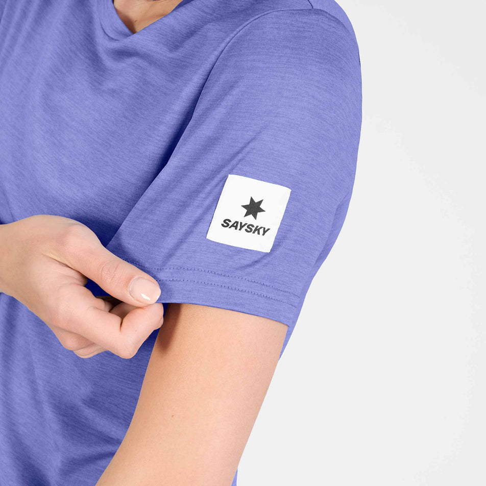 Close-up view of the SAYSKY logo on the SAYSKY Women's Clean Pace T-Shirt in the Purple colourway.