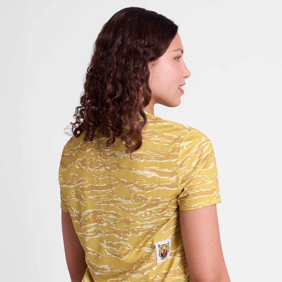 Back view of a model wearing the SAYSKY Women's Tiger Combat T-Shirt in the Yellow colourway.
