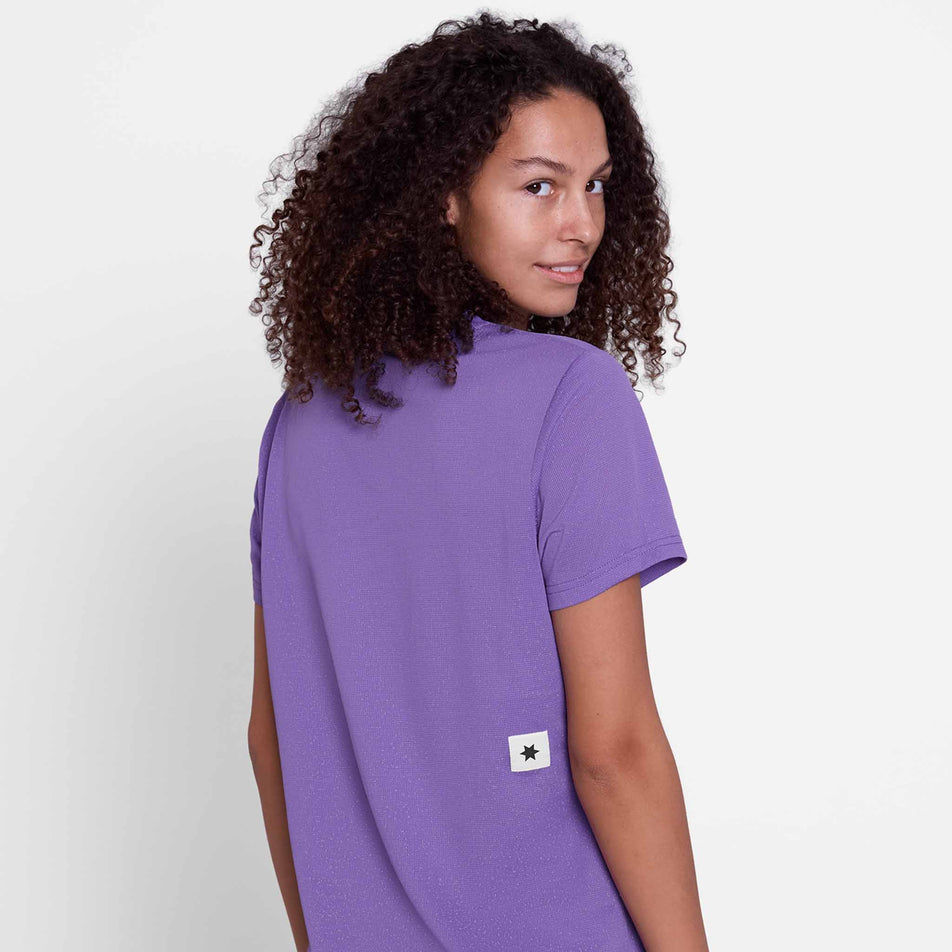 Back view of a model wearing the SAYSKY Women's Universe Combat T-Shirt in the Purple Universe colourway.
