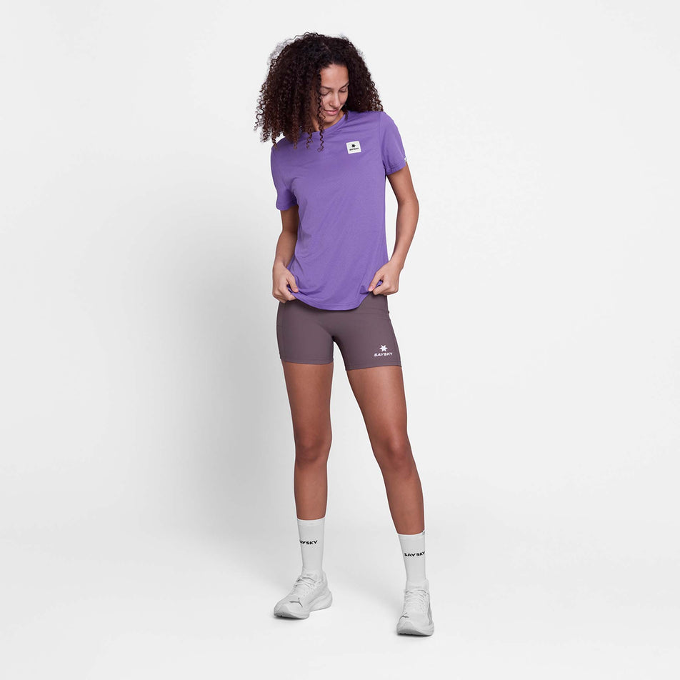Front view of a model wearing the SAYSKY Women's Universe Combat T-Shirt in the Purple Universe colourway.