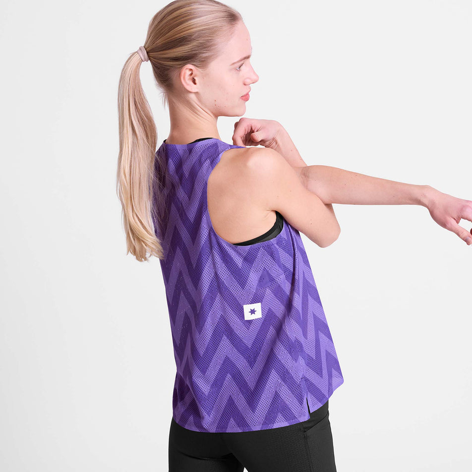 Angled view of a model wearing the SAYSKY Women's Zig Zag Flow Air Singlet in the Purple Zig Zag colourway.