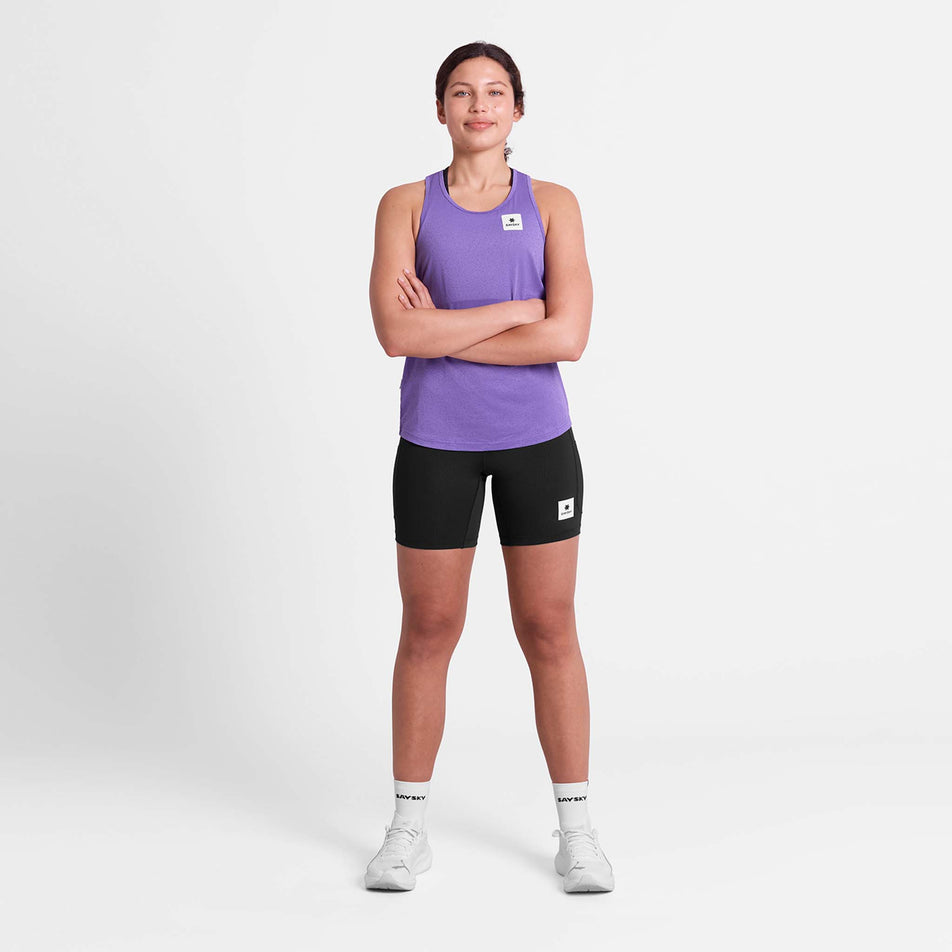 Front view of a model wearing the SAYSKY Women's Universe Combat Singlet in the Purple Universe colourway.