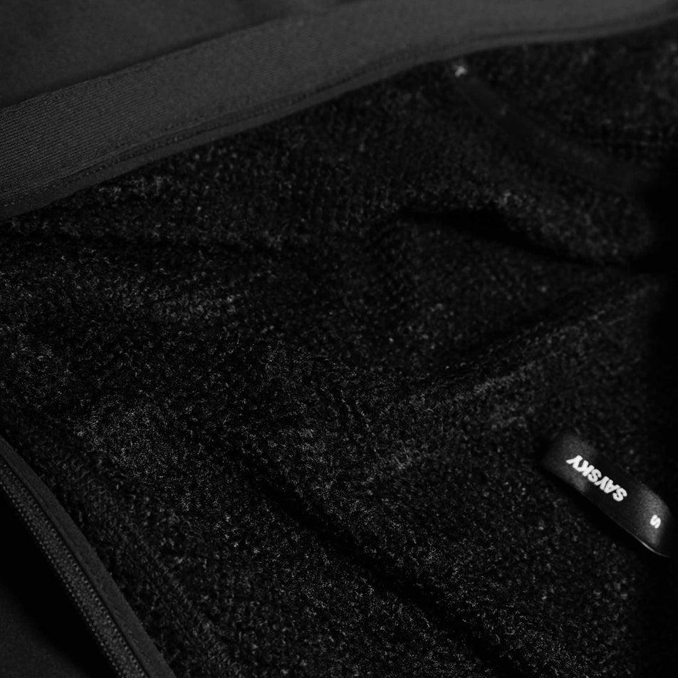 Close-up view of the fabric of the SAYSKY Combat Half Zip Fleece Hoodie in the Black colourway.