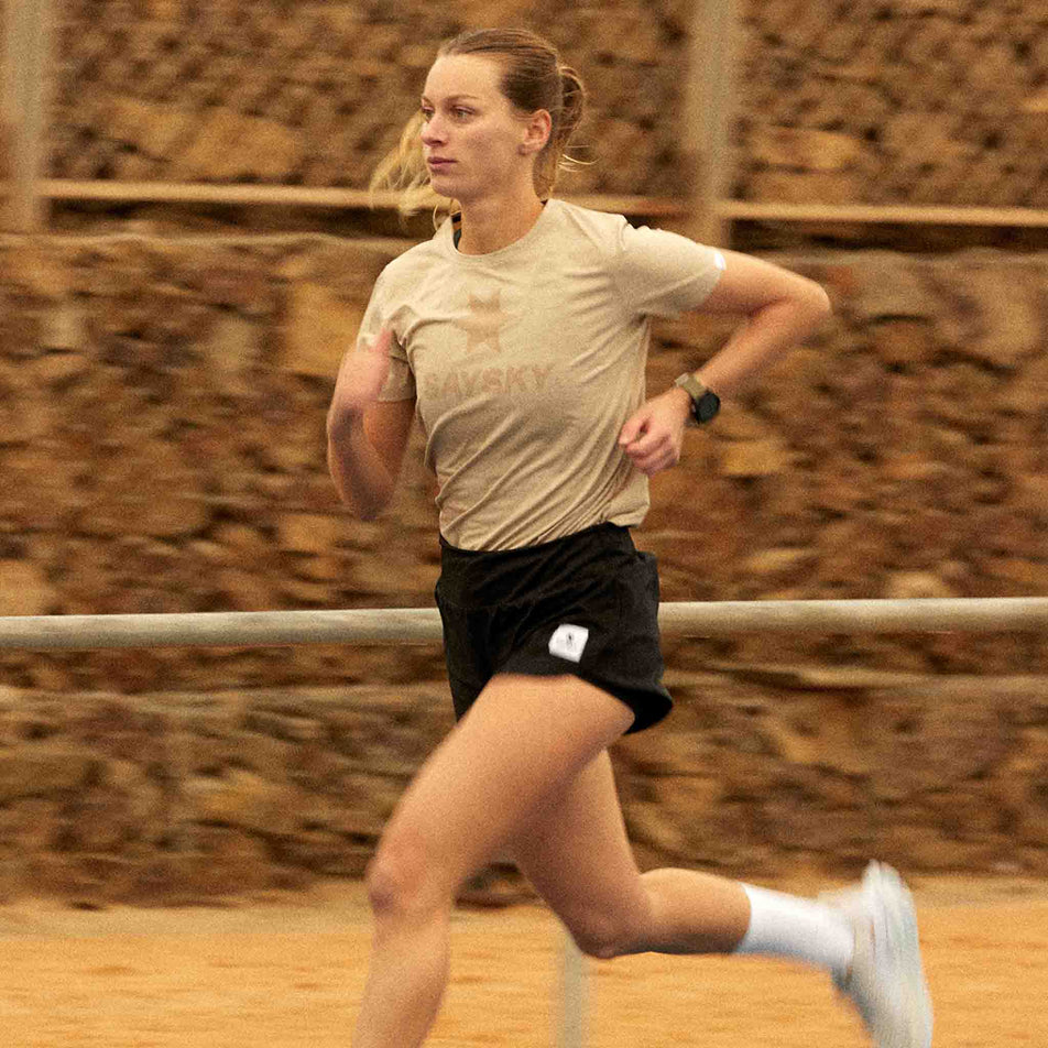 Angled view of a model wearing the SAYSKY Women's 2 In 1 Pace Shorts 3